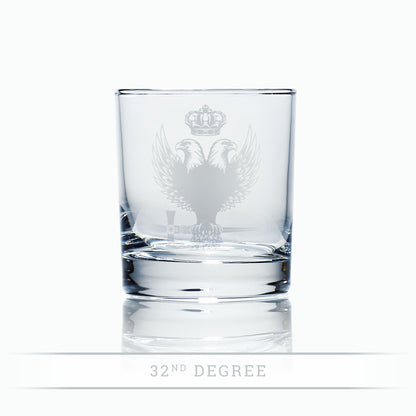 freemasons 32nd degree masonic double headed eagle, crown and sword engraved whisky glass on a white background
