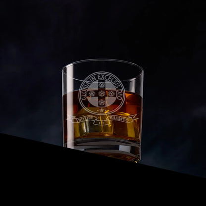 Engraved Royal Order of Scotland whisky glass with emblem, photographed on black background