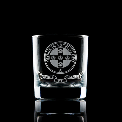 Engraved Royal Order of Scotland whisky glass with emblem, photographed on black background