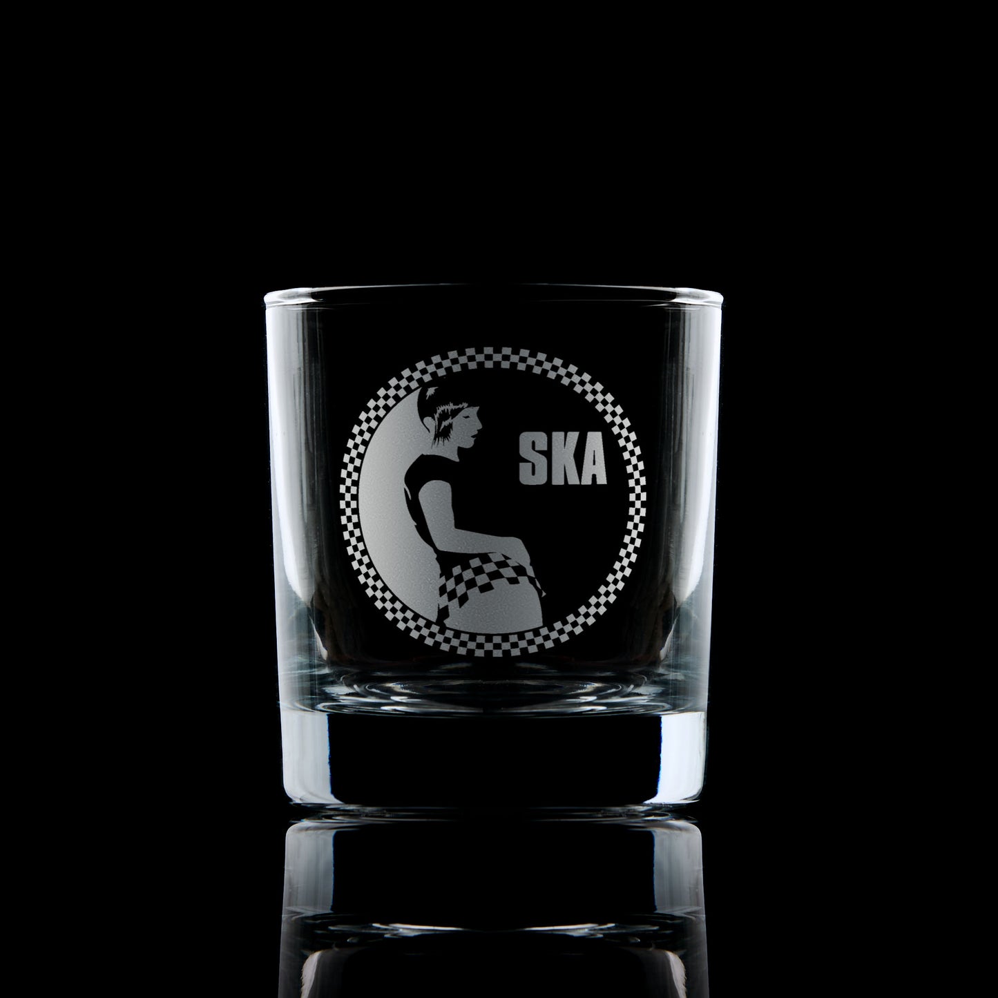 Engraved whisky glass with a Rude Girl in checkerboard skirt and Ska text – circular design with checker border in 2 Tone style