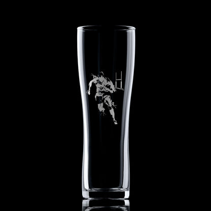 Clear glass with a black and white graphic of a rugby player on a black background