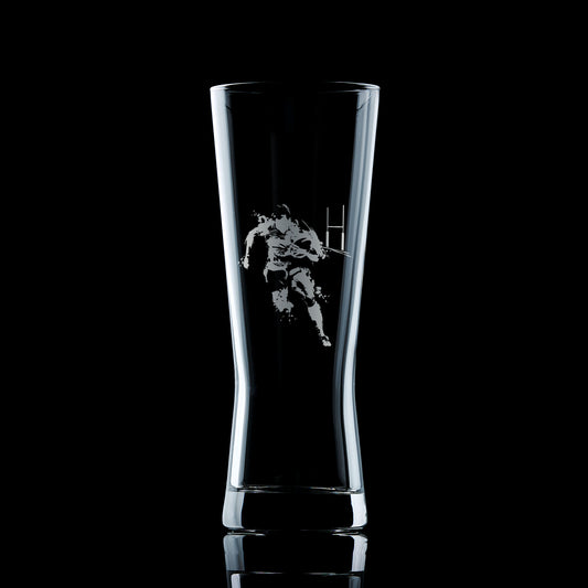 engraved pint pilsner glass featuring a rugby play, ball and goal posts