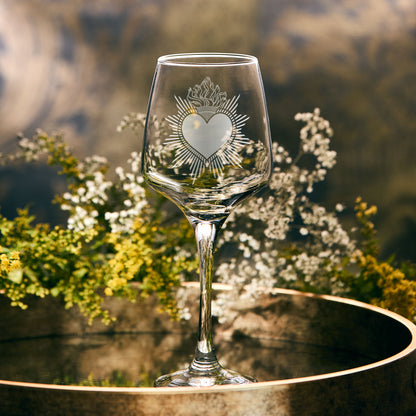 Wine glass engraved with a sacred milagro heart, also known as a "Sagrado Corazón" or "Sacred Heart" in Spanish