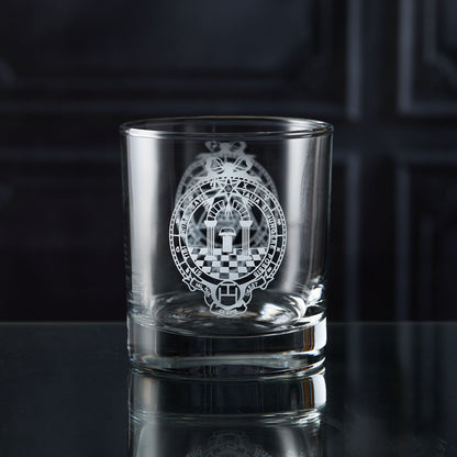 Clear glass whisky tumbler with engraved masonic royal arch design on a dark surface