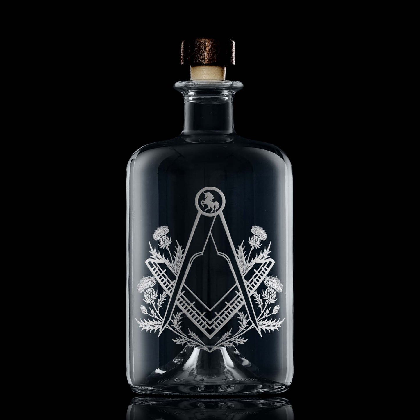 Apothecary style decanter engraved with a masonic square and compass surrounded by scottish thistles
