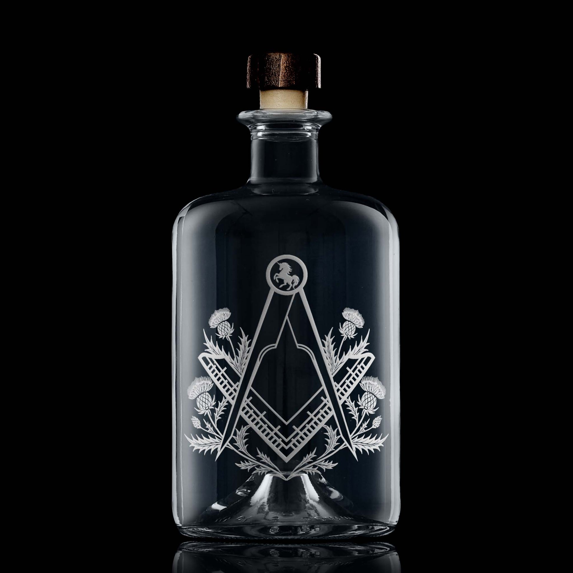 Apothecary style decanter engraved with a masonic square and compass surrounded by scottish thistles