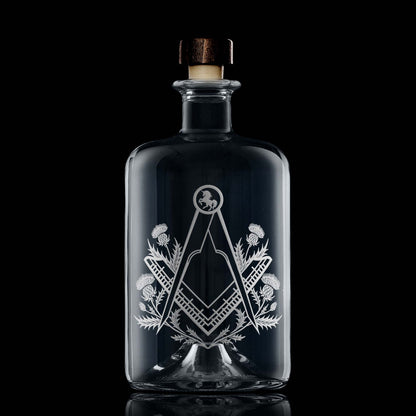 Apothecary style decanter engraved with a masonic square and compass surrounded by scottish thistles
