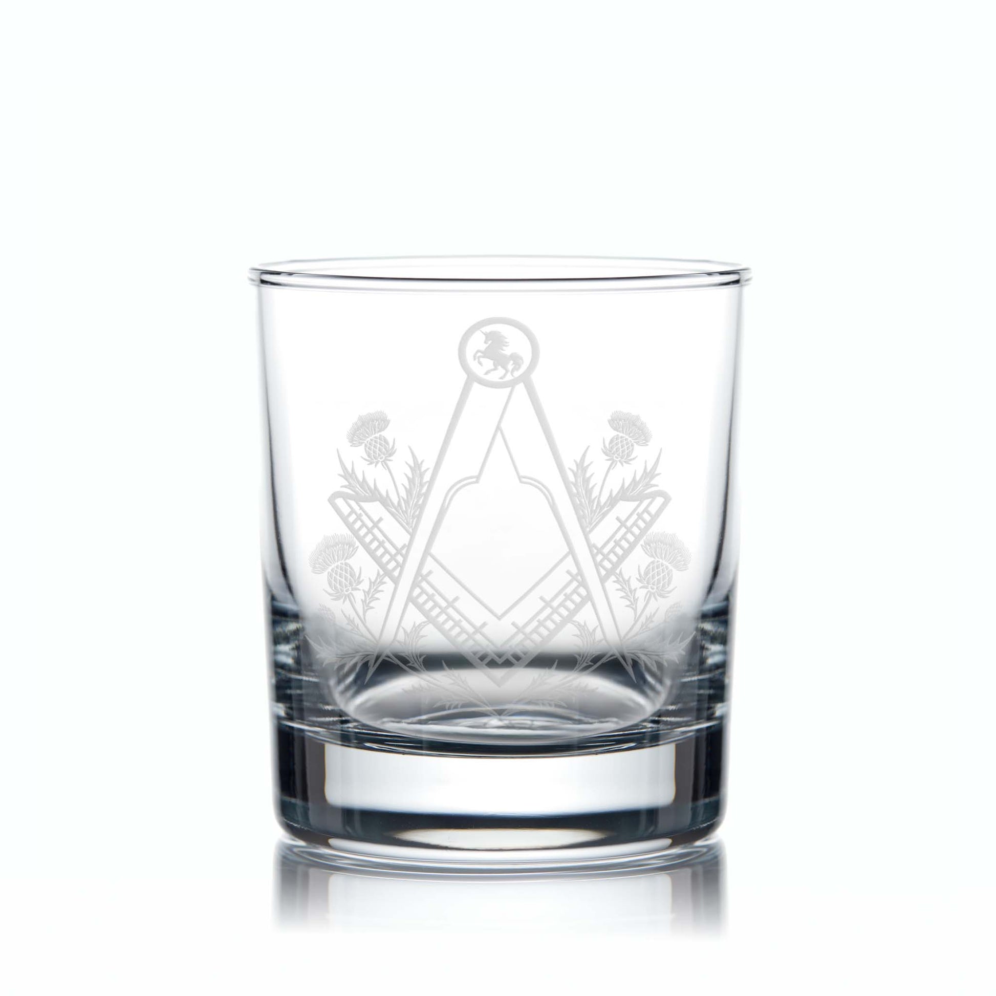 Engraved Masonic whisky glass with Square & Compass, thistles, and Scottish Unicorn, shown on a white background