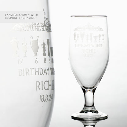 Engraved stemmed beer glass featuring a completed customer example with personalisation above and below the Shankly Gates design. Text shown for demonstration only.
