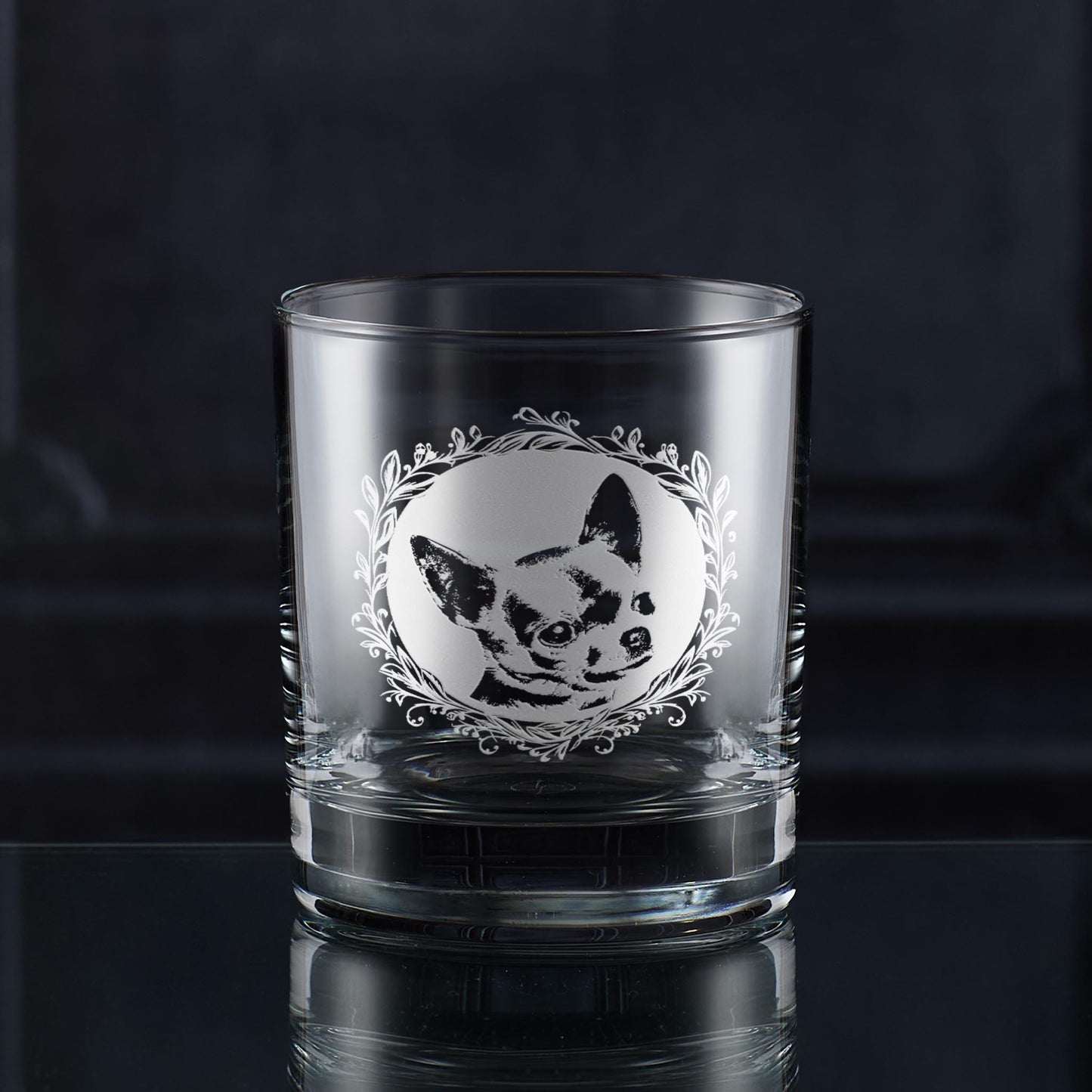 Whisky glass with engraved shorthaired chihuahua portrait in circular frame with leafy garland