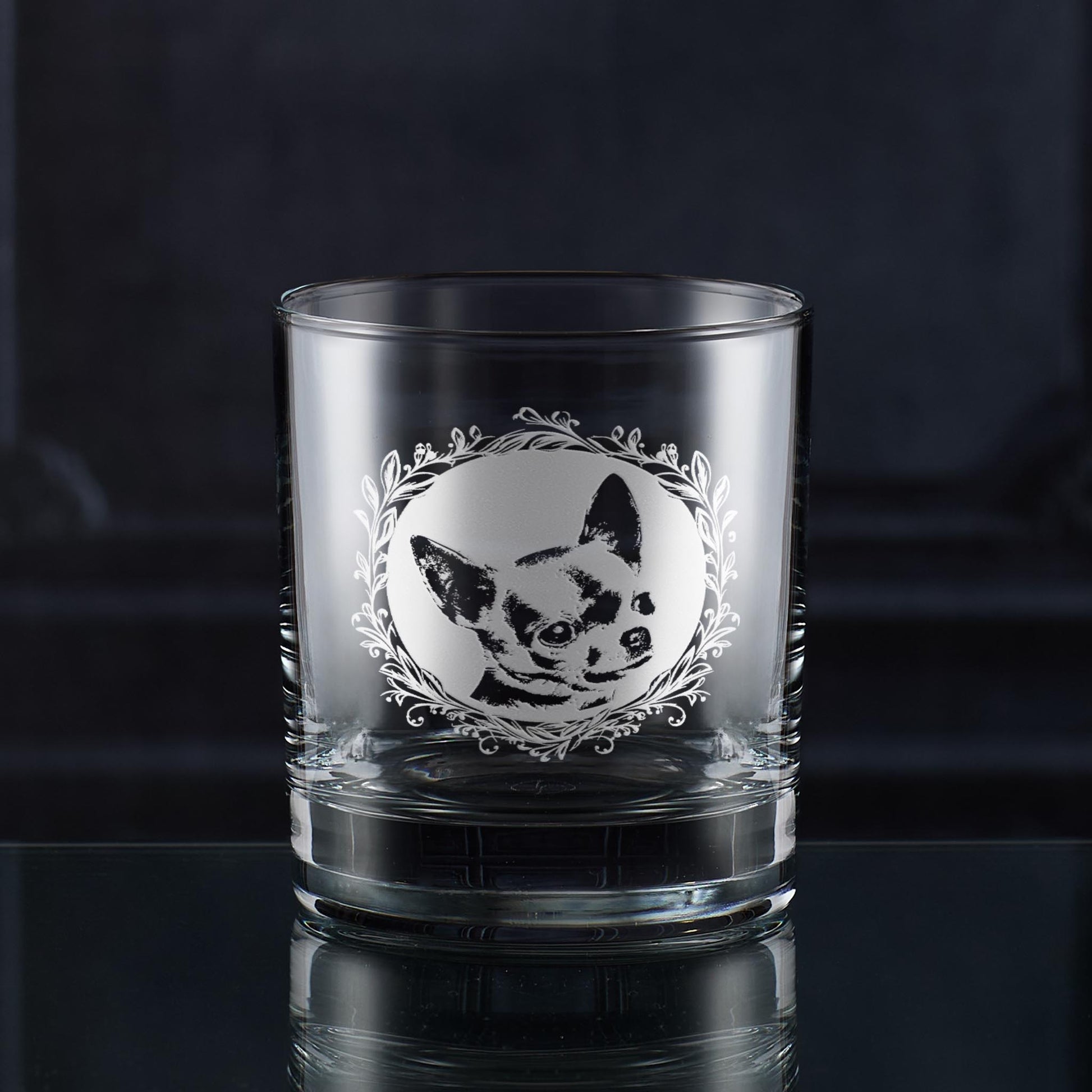 Whisky glass with engraved shorthaired chihuahua portrait in circular frame with leafy garland
