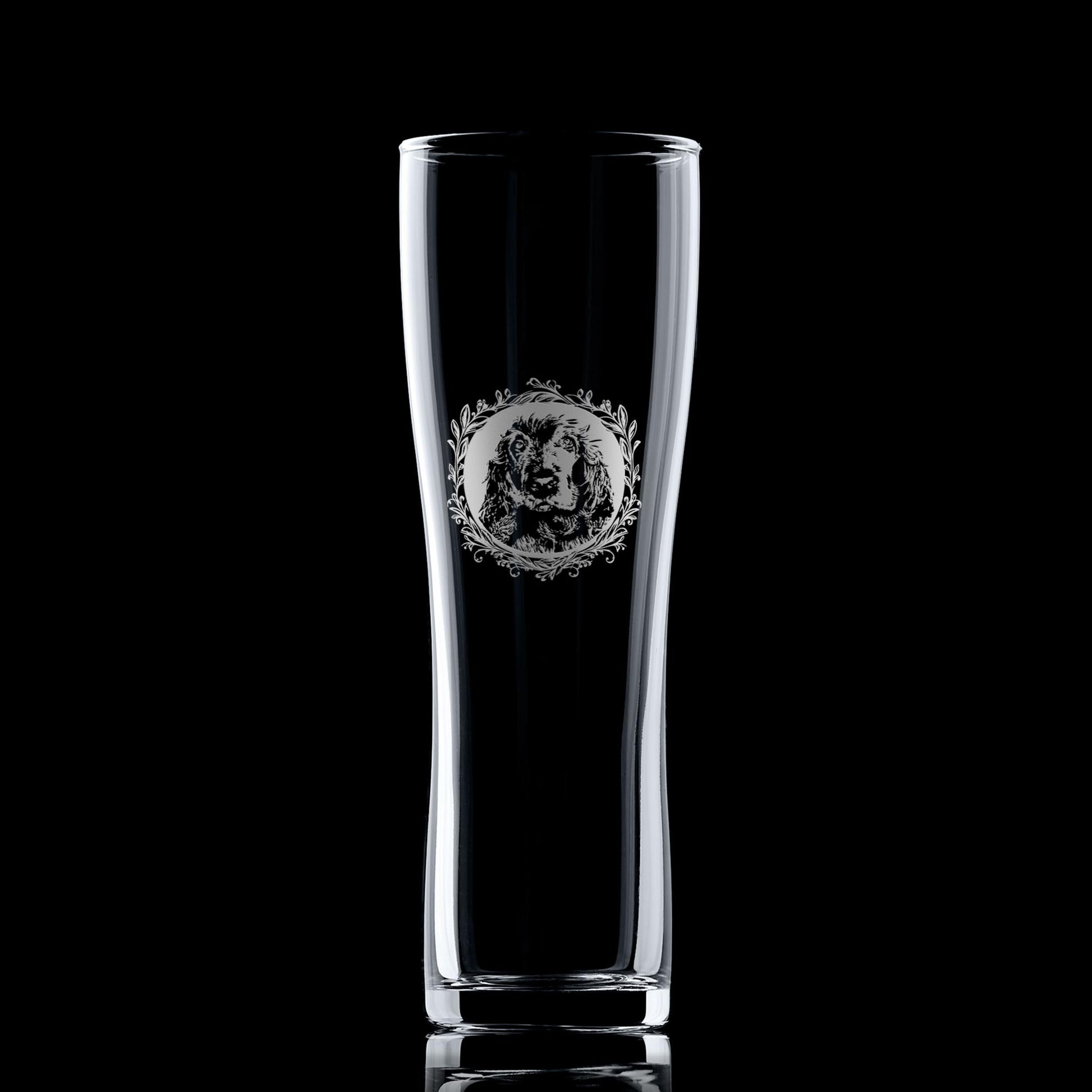 Pint glass with engraved show cocker spaniel portrait in circular frame with leafy garland