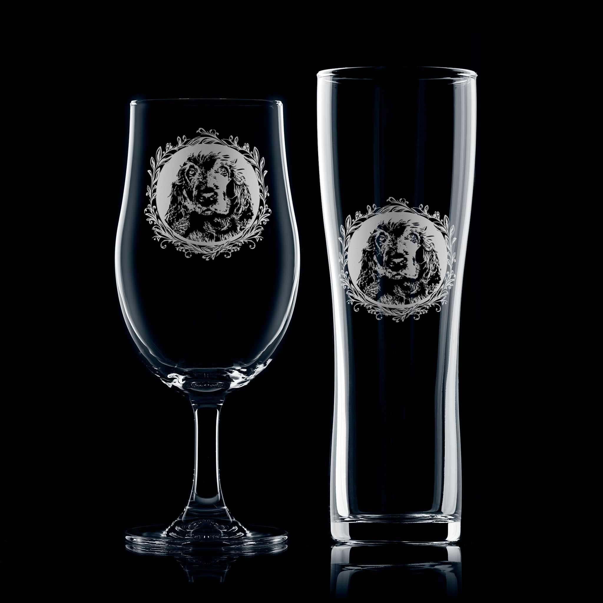 Pair of Cocker Spaniel engraved beer glasses, illustrated with a dog portrait and leafy garland