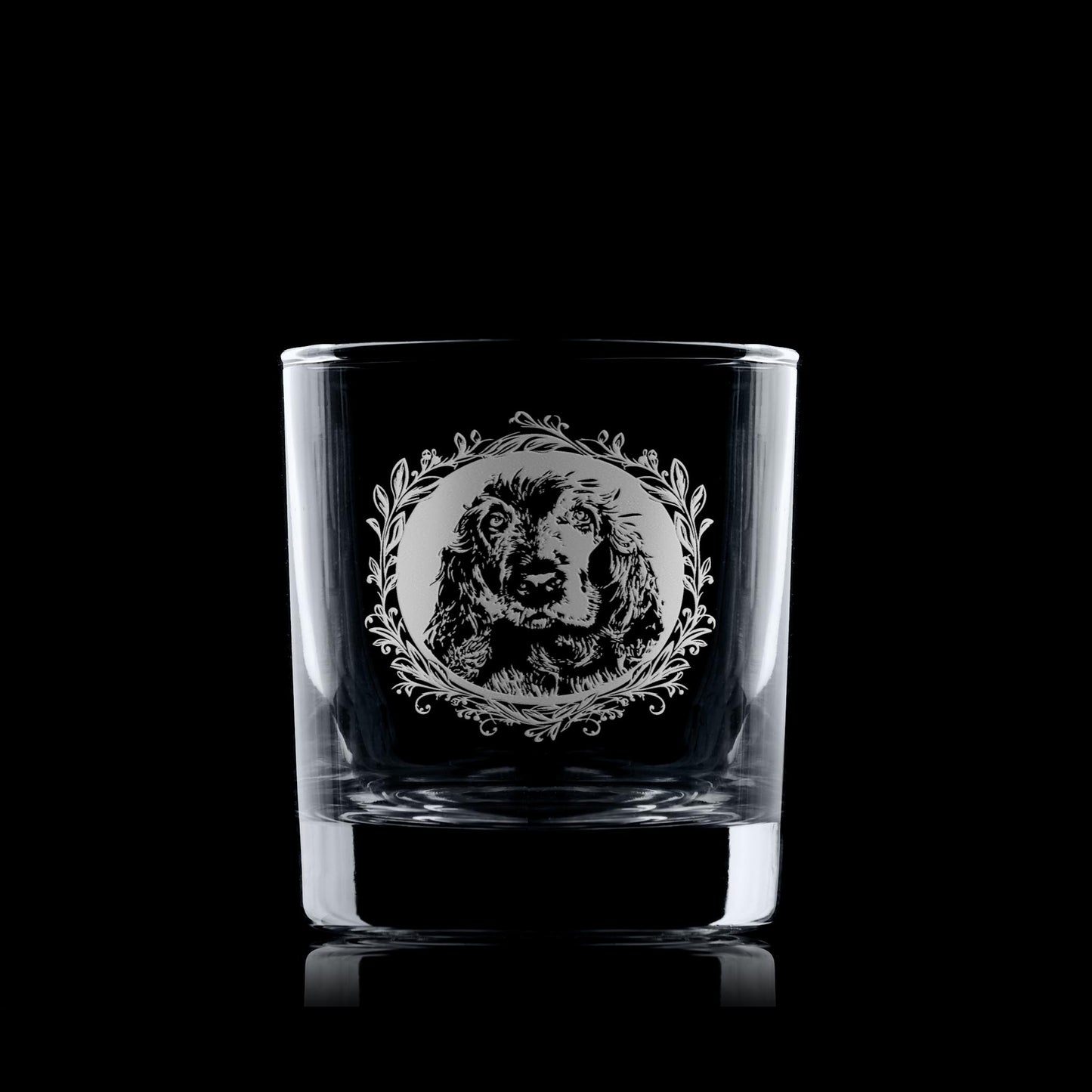 Whiskey glass with engraved show cocker spaniel framed with leafy garland