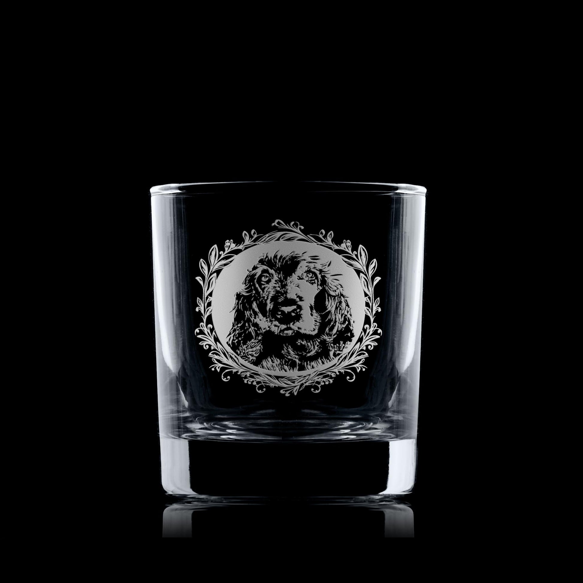 Whiskey glass with engraved show cocker spaniel framed with leafy garland