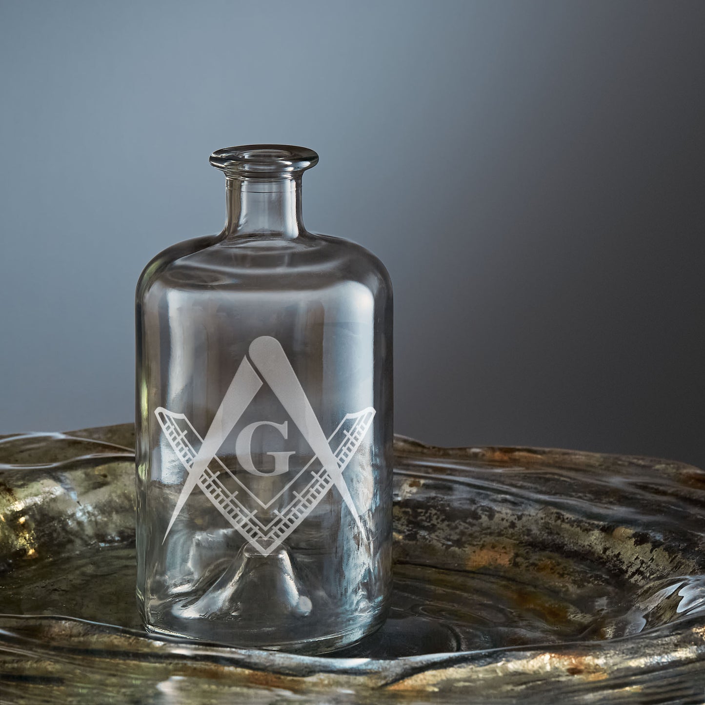 masonic decanter engraved with a master mason's square and compass