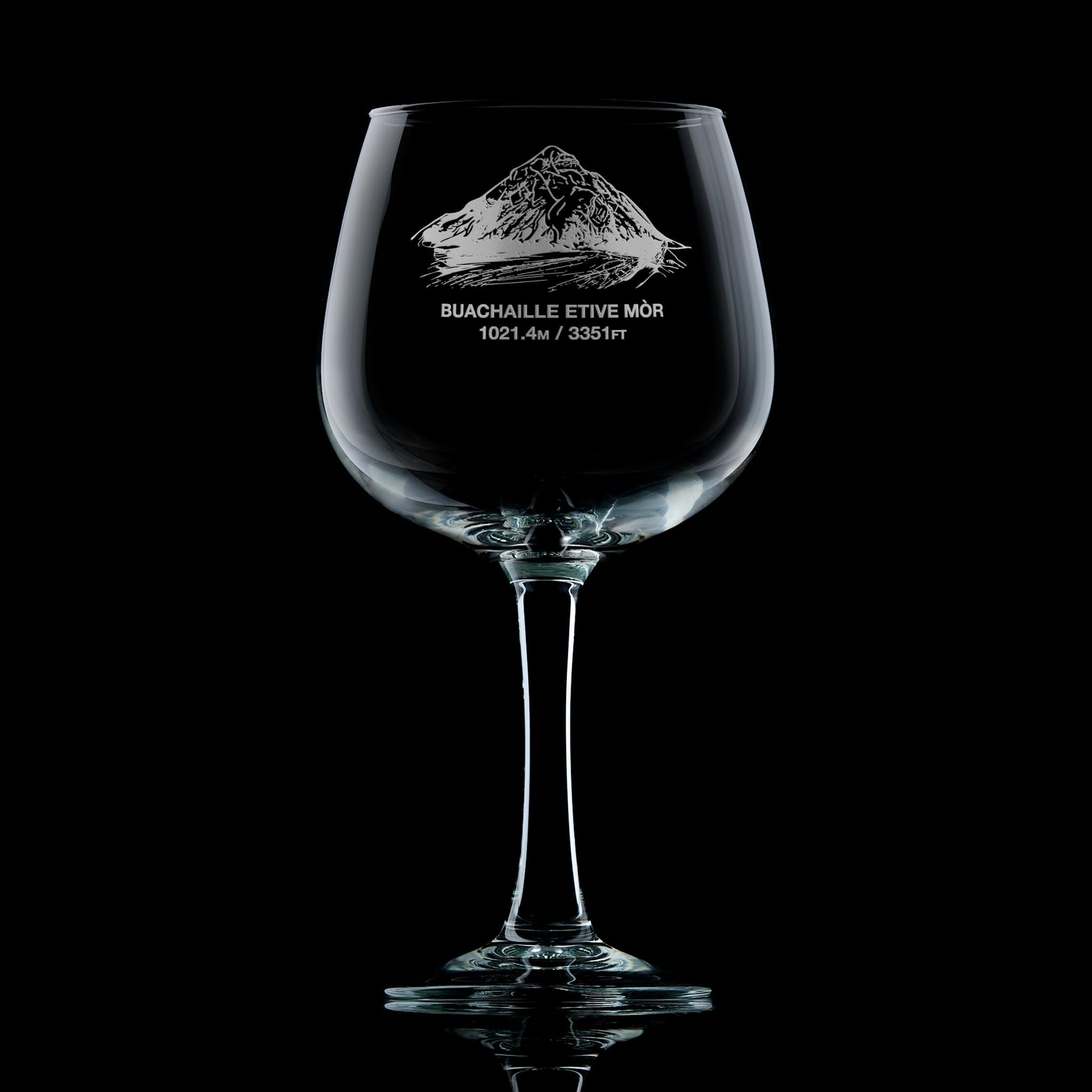 Balloon gin glass engraved with Stob Dearg on Buachaille Etive Mòr, photographed on a black background