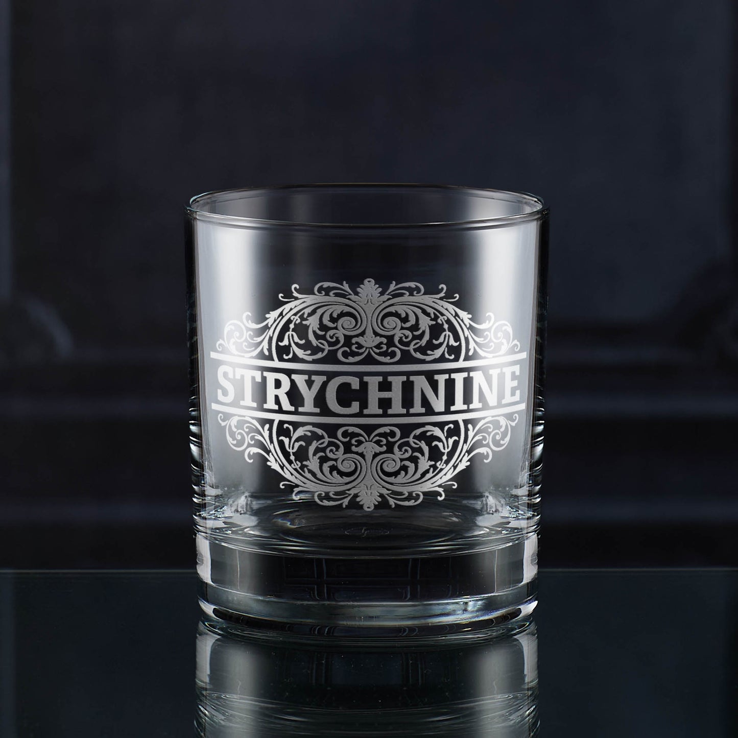 Whisky tumbler engraved with an ornate Strychnine poison-label design
