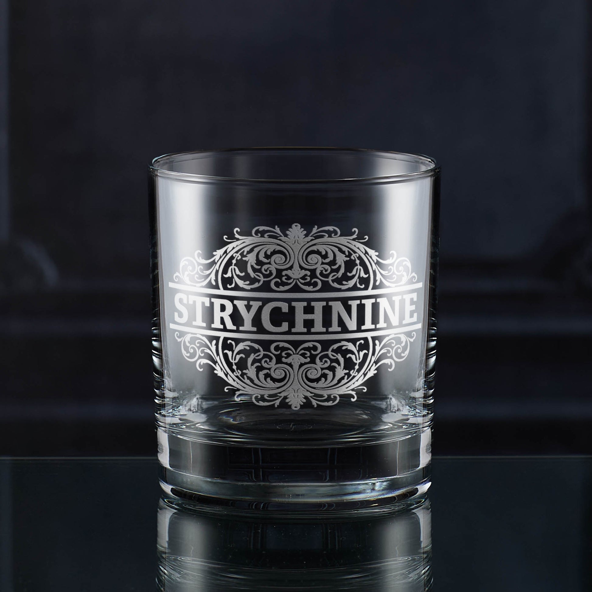 Whisky tumbler engraved with an ornate Strychnine poison-label design