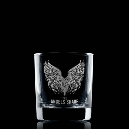 Whisky glass engraved with an intricate illustration of angels wings and the words The Angels Share