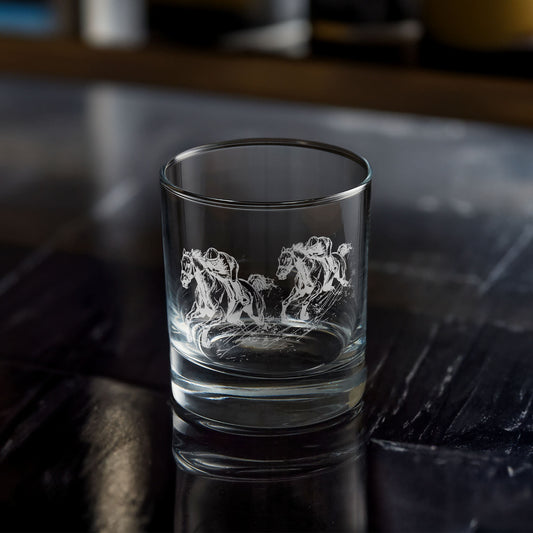 Equestrian whisky glass with an engraved horse design on a dark surface