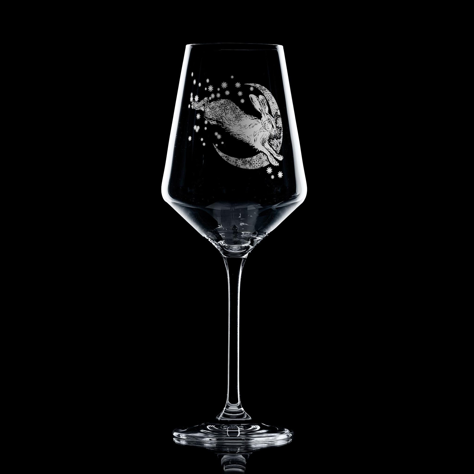 Engraved wine glass featuring Snow Hare in winter folklore design
