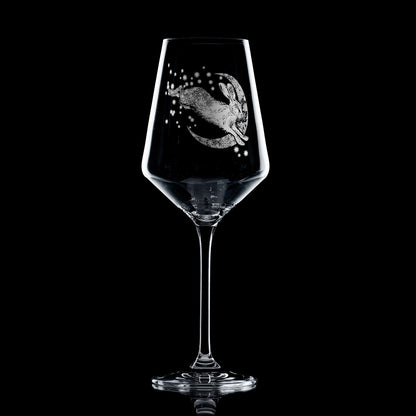 Engraved wine glass featuring Snow Hare in winter folklore design