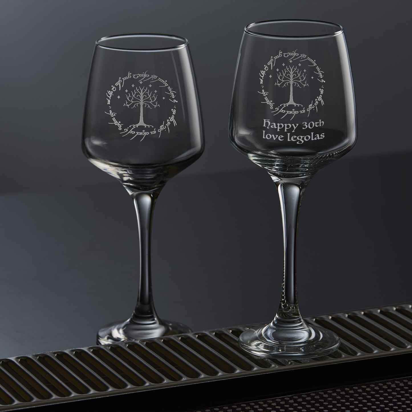 engraved wine glass with white tree, stars and elvish text