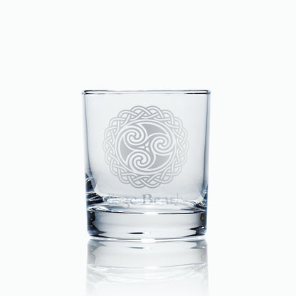 Uisge Beatha whisky glass, engraved with water symbol and celtic knotwork design on a white background