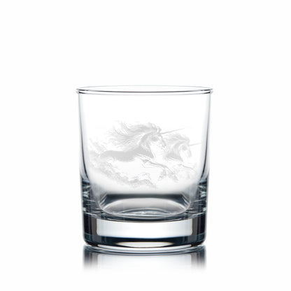 Clear glass tumbler with engraved unicorn design on a white background