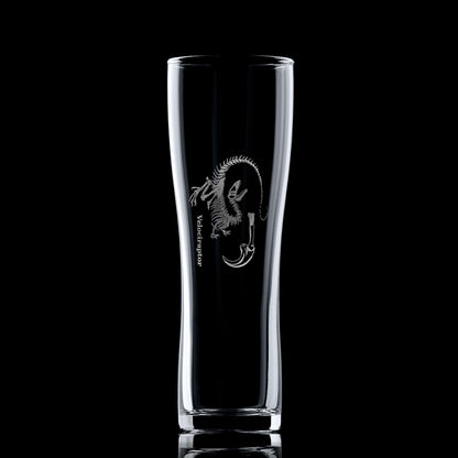 Dinosaur pint glass engraved with a Velociraptor fossil