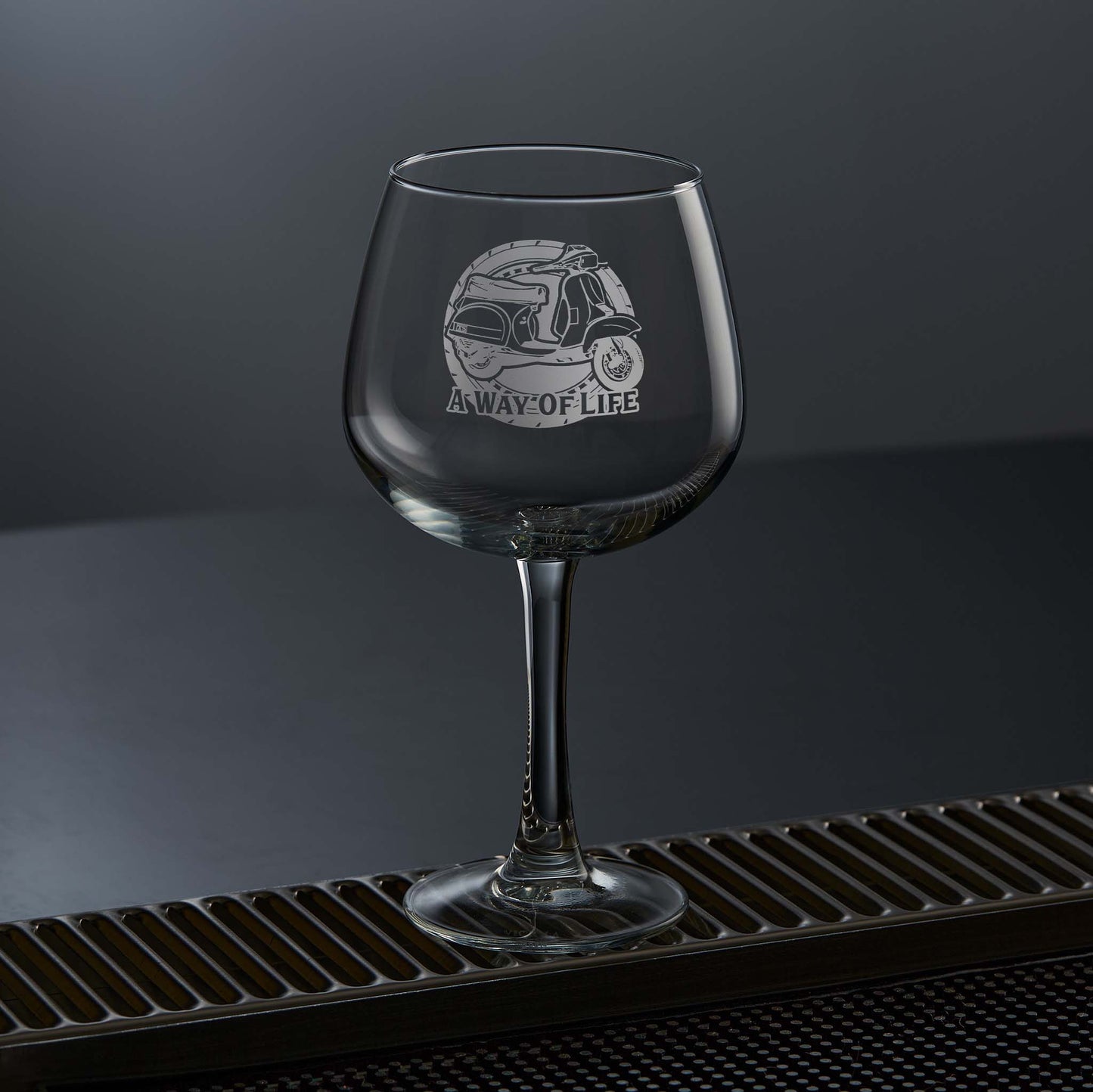 stemmed ballon gin glass engraved with a vespa T5 scooter