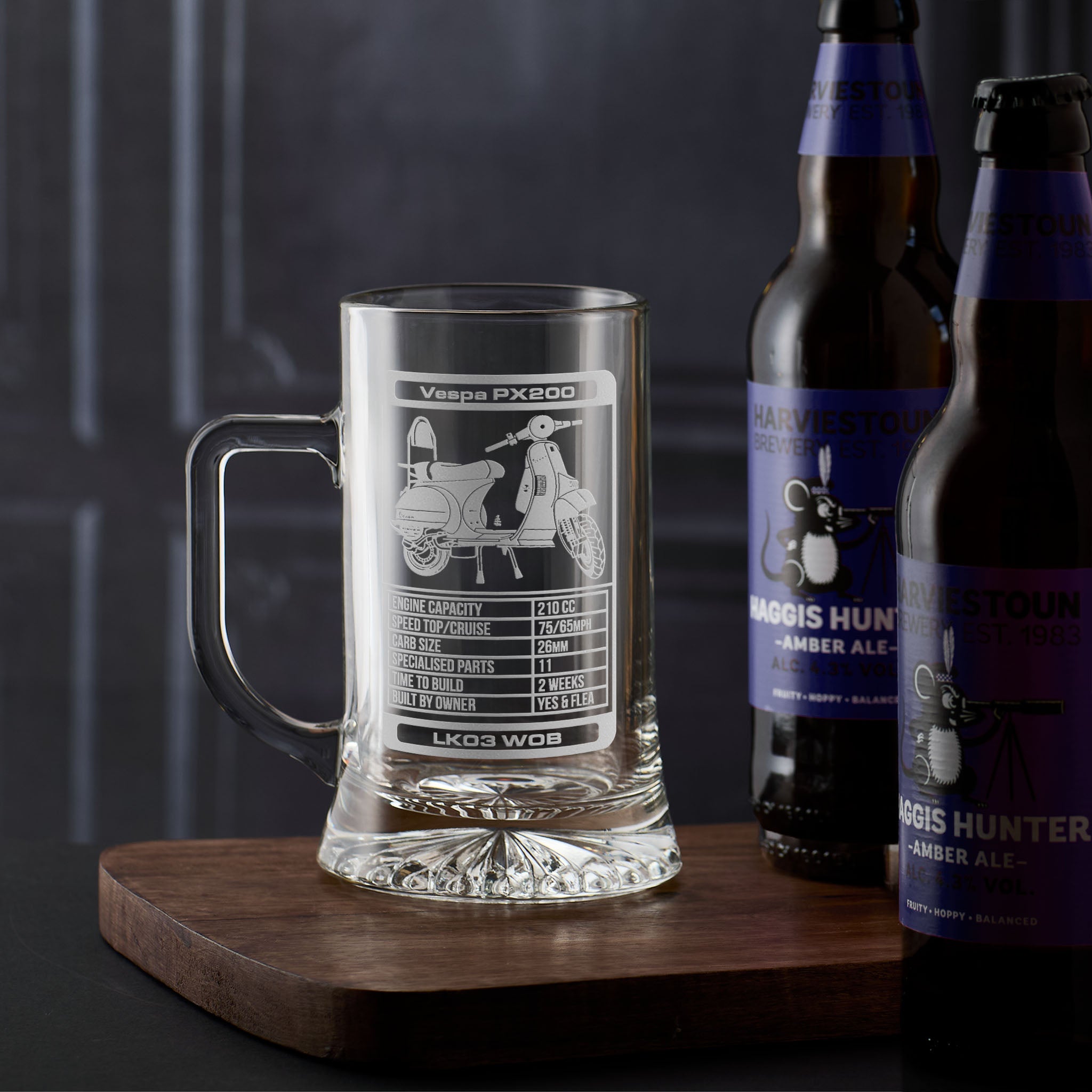Personalised tankard engraved with a Vespa PX200, number plate and top trumps design on a dark background