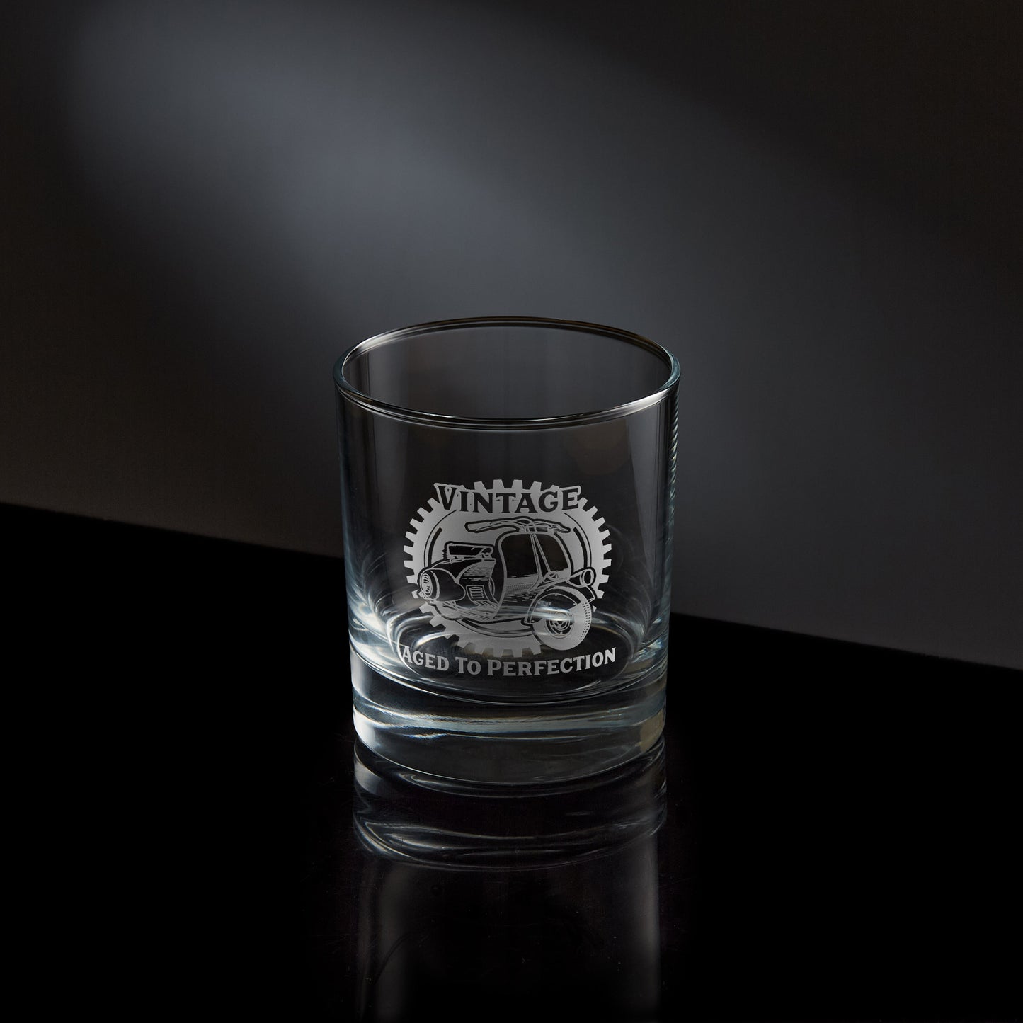 whisky glass engraved with a vintage farro basso vespa scooter