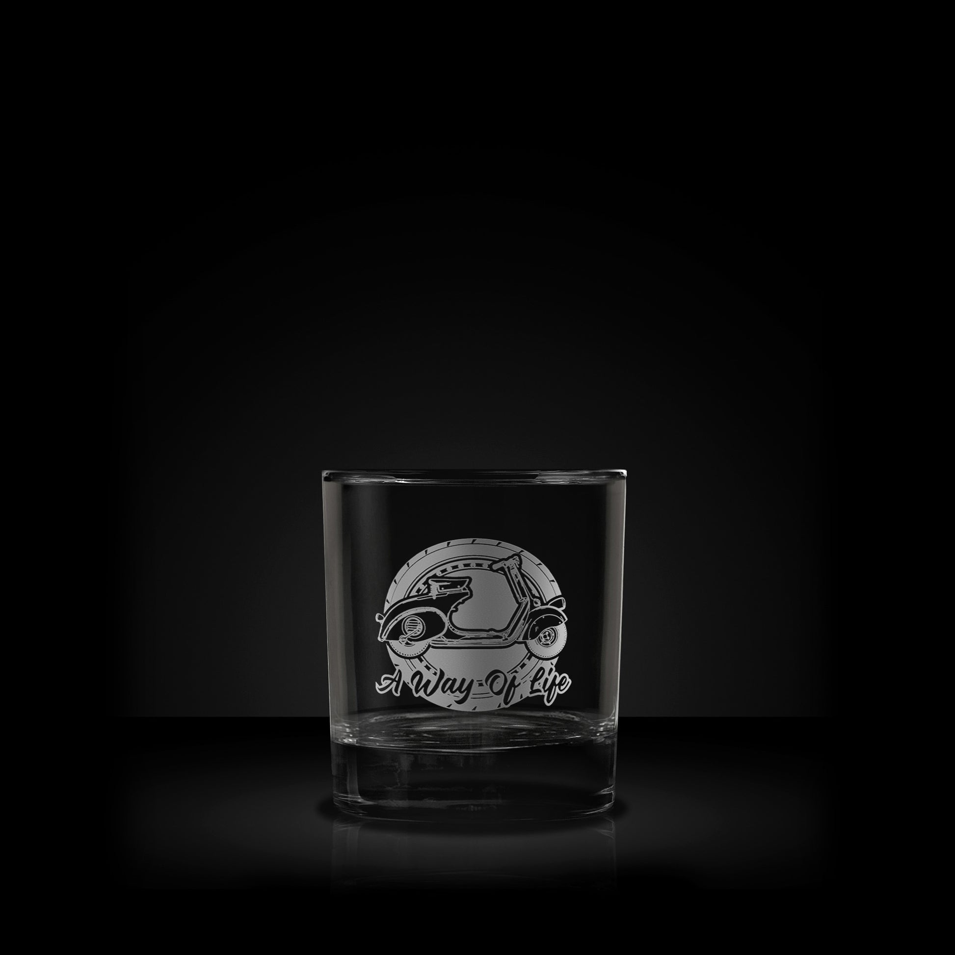 whisky glass engraved with a vintage farro basso vespa scooter