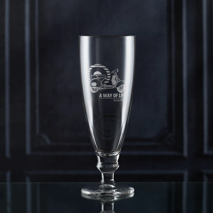 Stemmed beer glass engraved with Vespa GS150 scooter and Mod target, shown against dark background