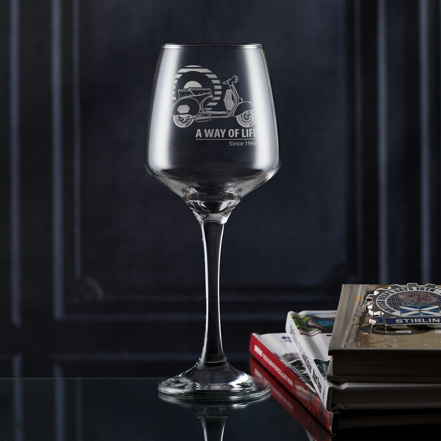 Vespa GS150 wine glass with Mod design, styled in a lifestyle setting with scooterist books