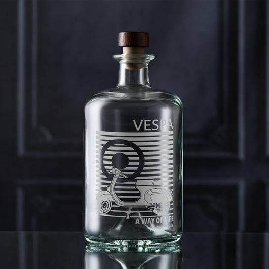 Vespa decanter bottle with wooden cap on a dark background