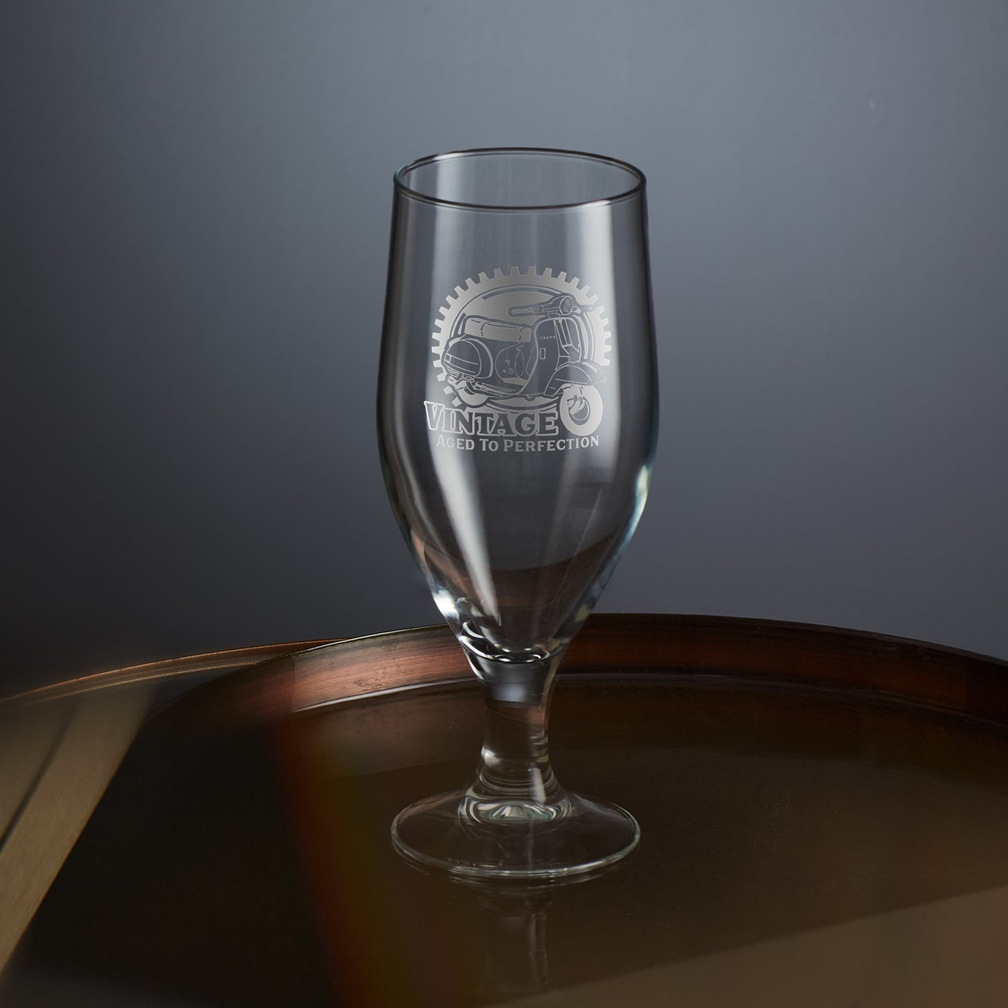 engraved scooter stemmed beer glass featuring a vespa px design