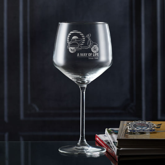 Gin glass engraved with a line drawing of a Vespa PX scooter, striped Mod target in the background, and the words ‘A Way of Life Since 1946’