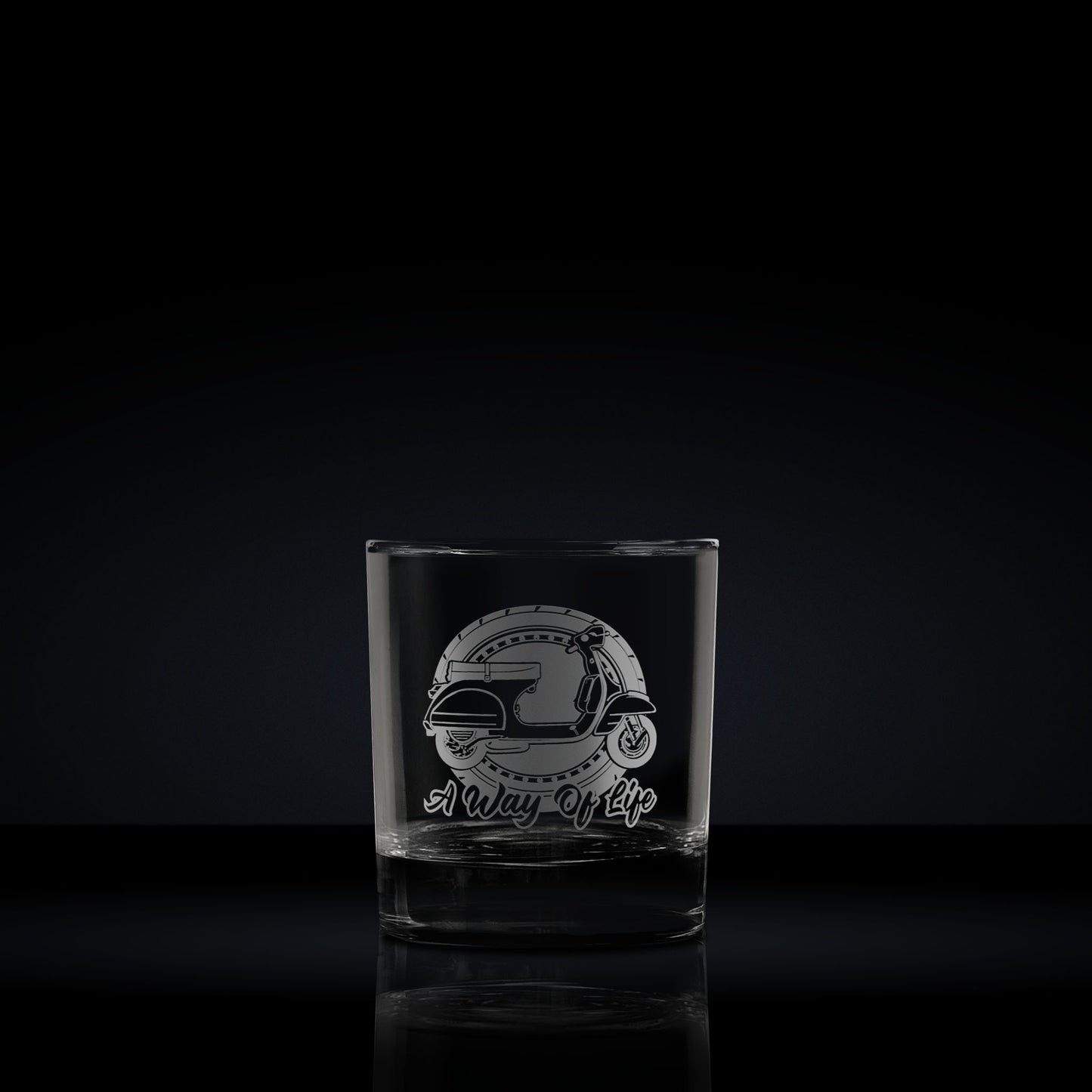 Engraved whisky glass etched with a vespa px scooter