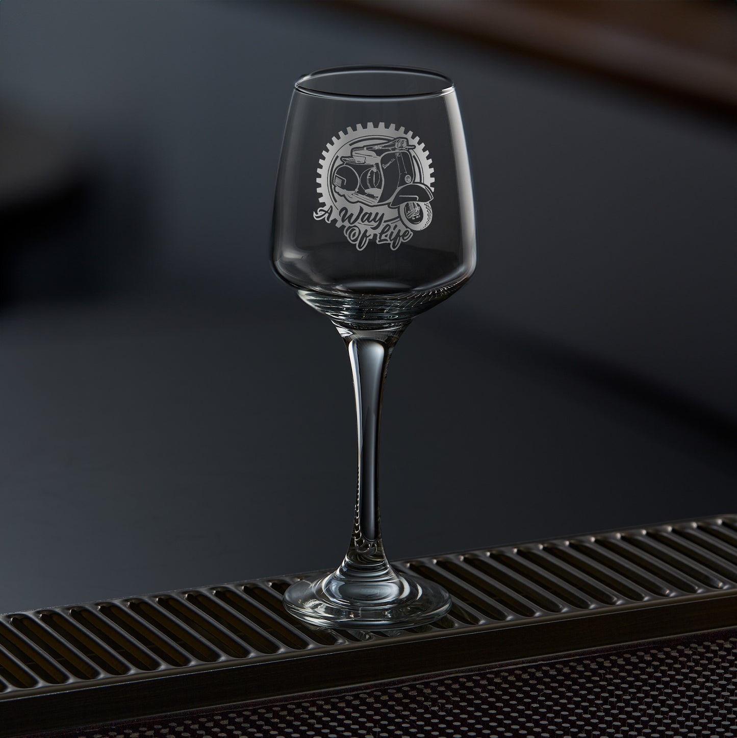 engraved wine glass featuring a vespa GL scooter