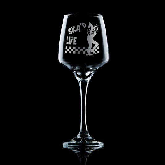 Engraved wine glass with Walt Jabsco dancing on a checkerboard floor – ska-inspired design with “Enjoy Yourself” text