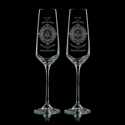 Pair of personalised wedding champagnes flutes, engraved with intricate patterns, Mr and Mrs, the couple names and wedding dates