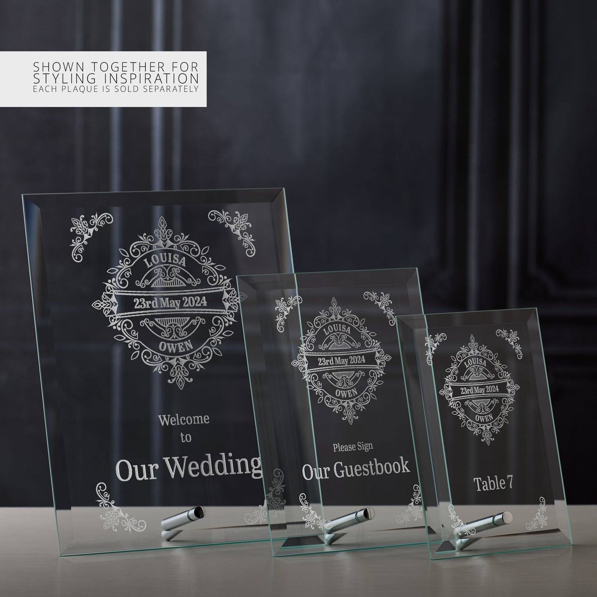 Three glass wedding signs with personalised text on a dark background