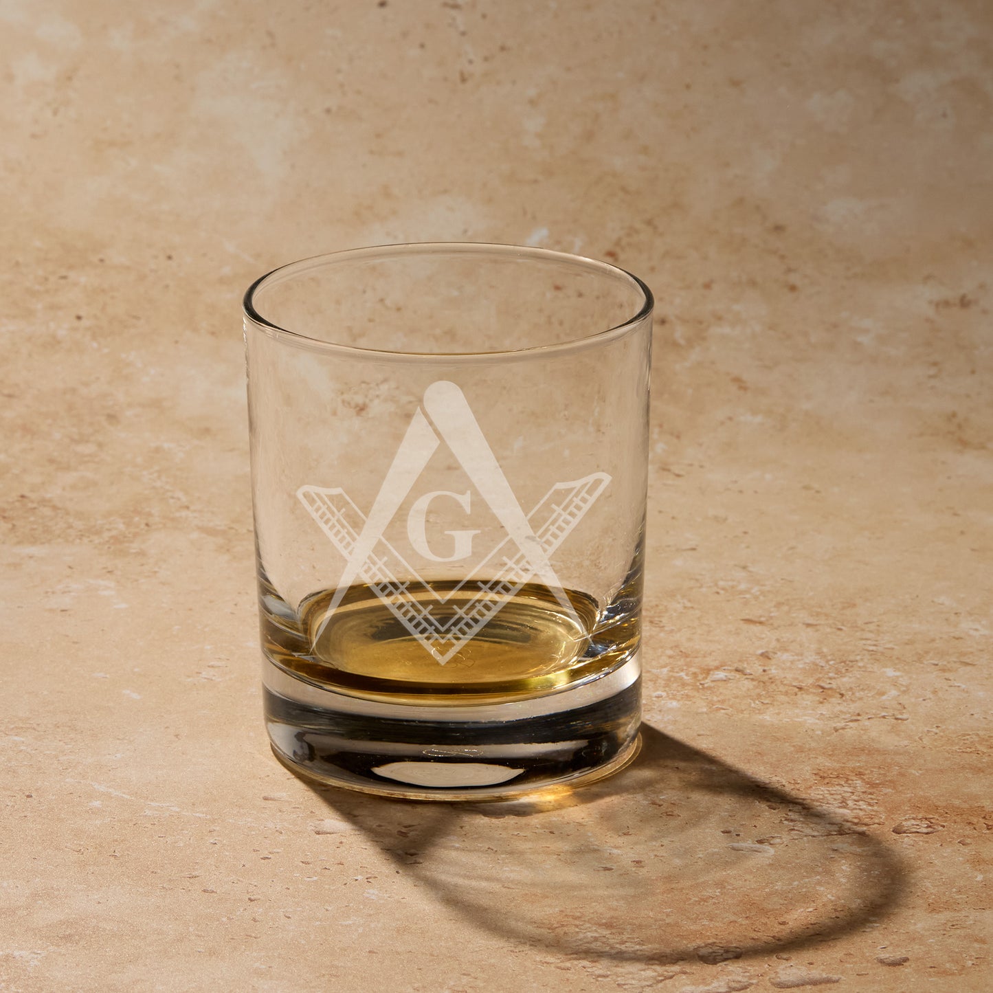 Engraved whisky glass with a Master Mason square and compass