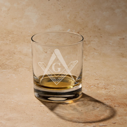Engraved whisky glass with a Master Mason square and compass