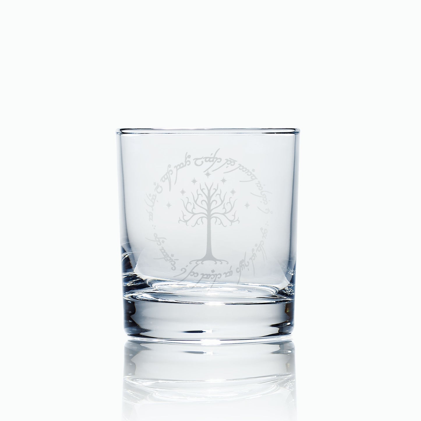 whisky glass engraved with lord of the rings elvish font and a tree