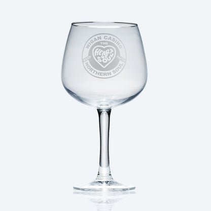 Copa de balón style gin glass with engraved Northern Soul wigan casino patch design, photographed on a white background for clarity and shape.