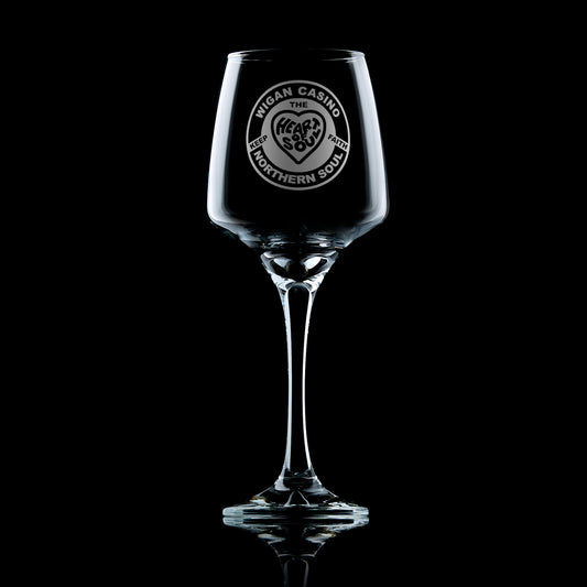 stemmed wine glass engraved with a Wigan Casino badge design